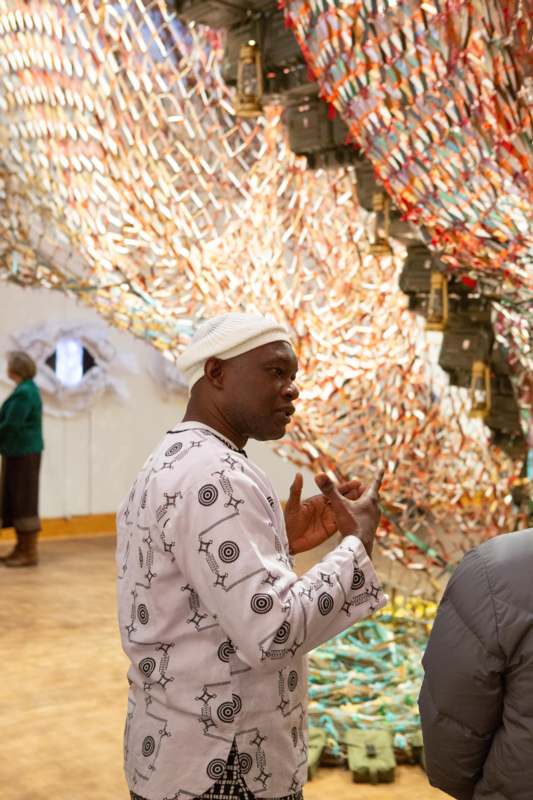 a man in a white shirt and white hat