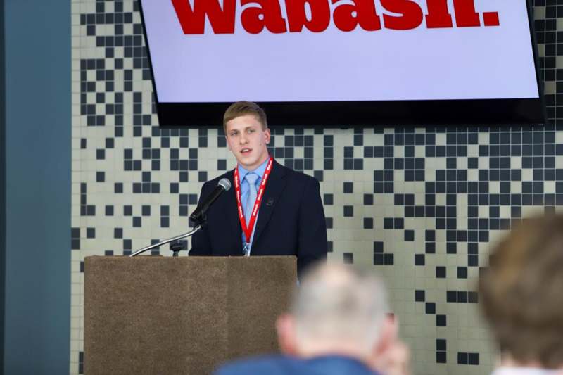 a man standing at a podium