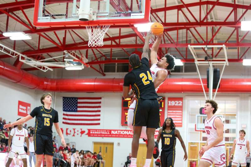 a group of people playing basketball