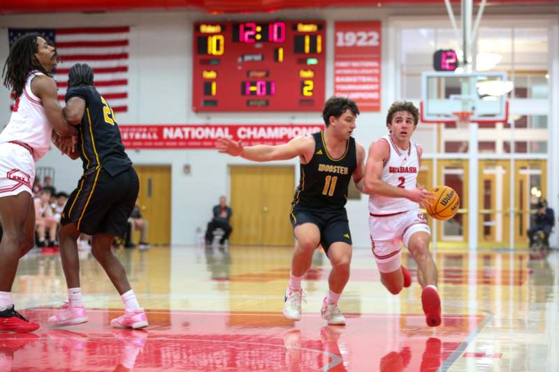 a group of men playing basketball