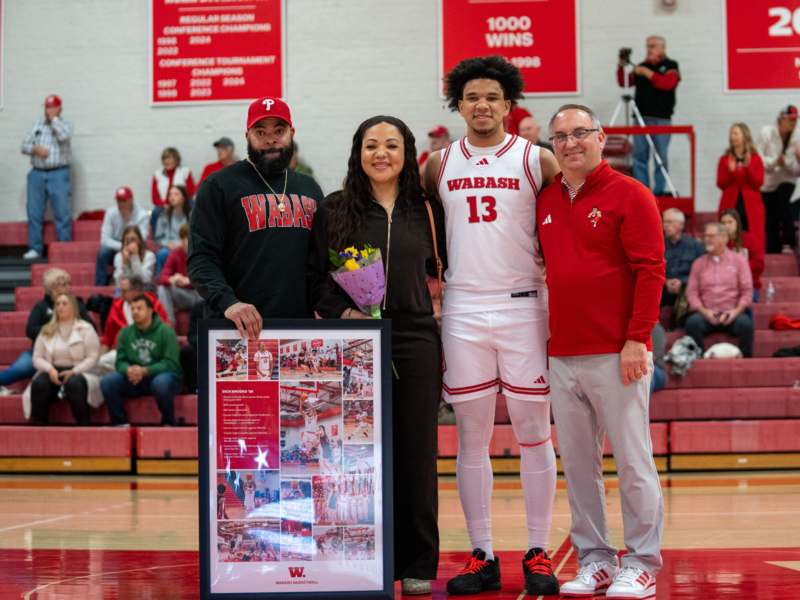 a group of people standing in a gym