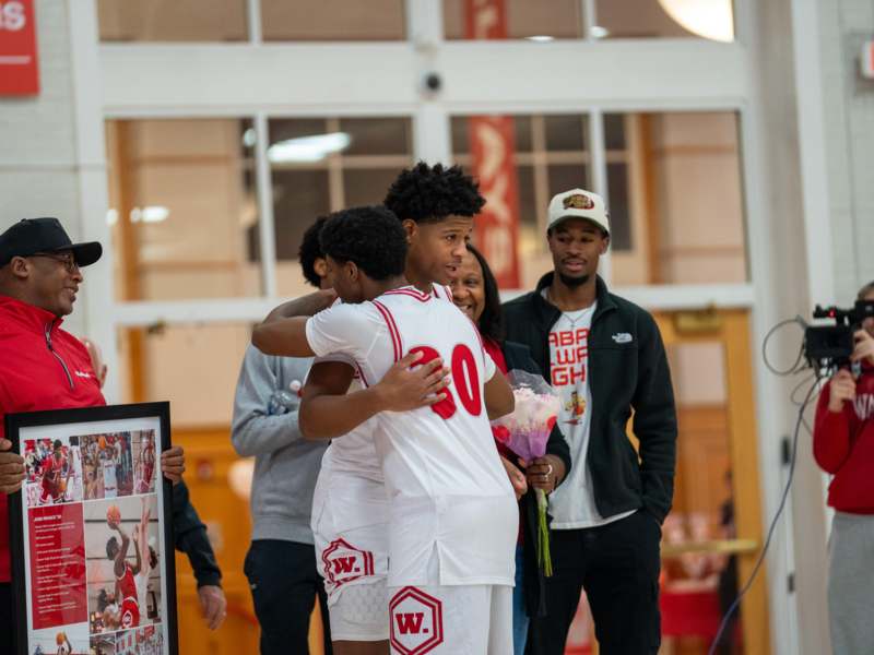 a group of people hugging each other