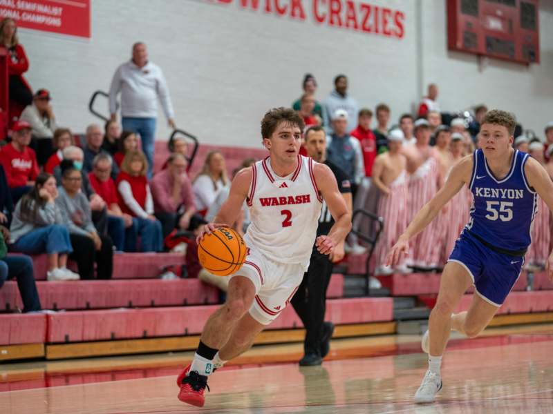 a group of people playing basketball
