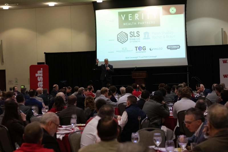 a man standing in front of a large group of people