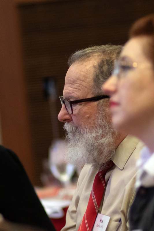 a man with a beard and glasses