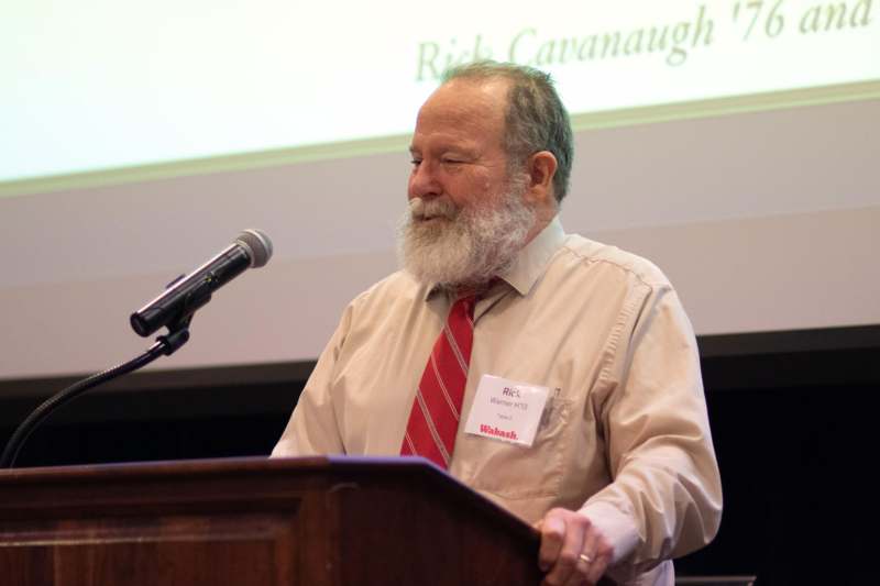 a man standing at a podium