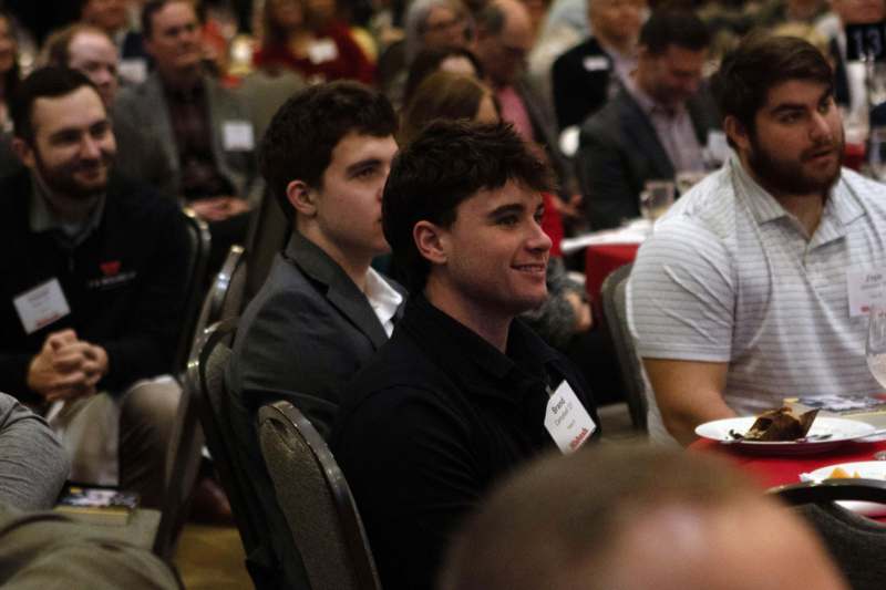 a group of people sitting in chairs