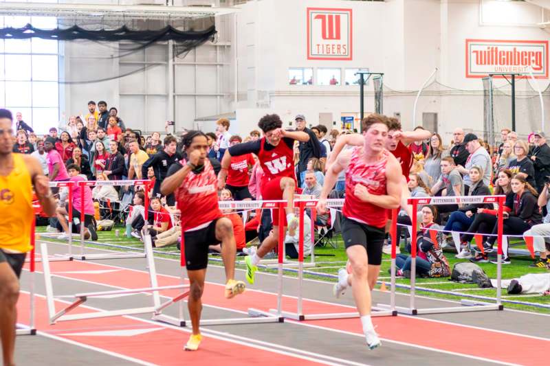 a group of people running on a track