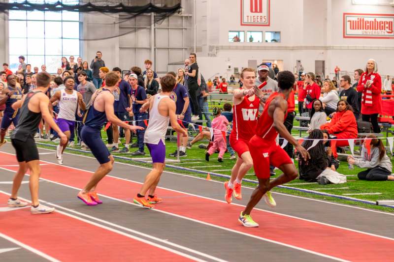 a group of people running on a track