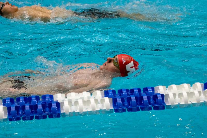 a man swimming in a pool