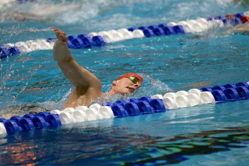 a man swimming in a pool