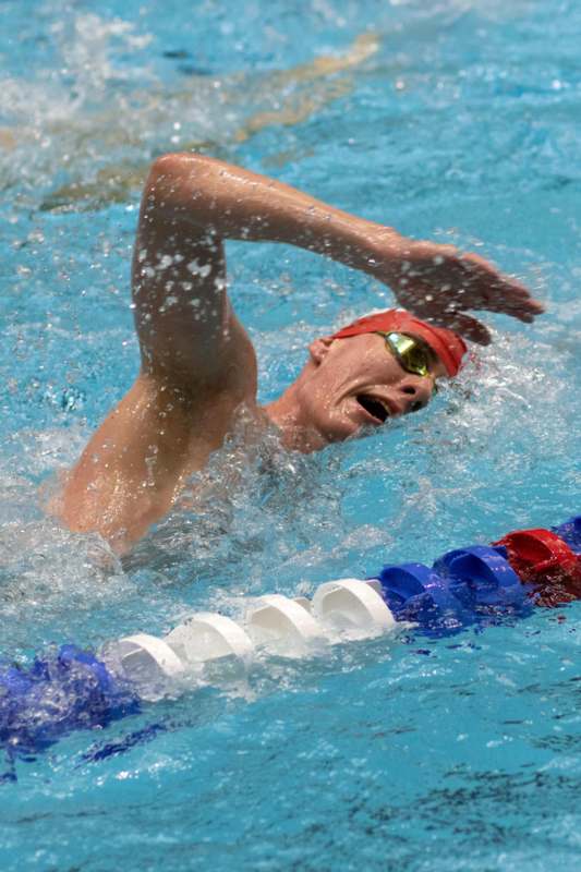 a man swimming in a pool