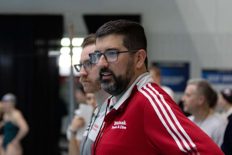 a group of men standing in a room