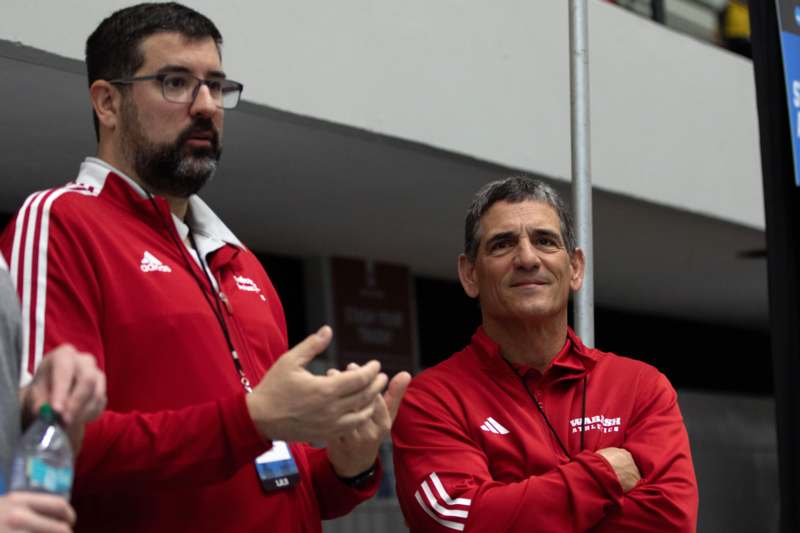 a group of men in red jackets
