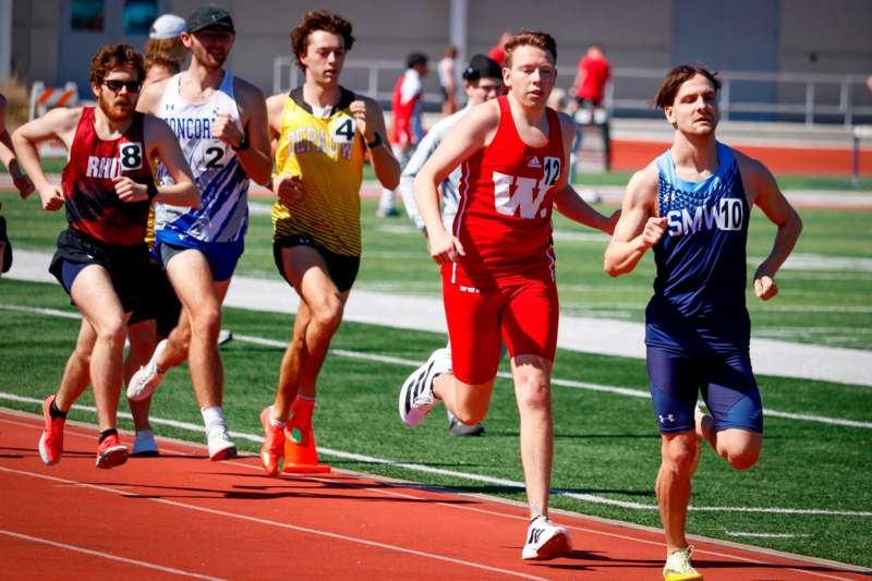 a group of men running on a track