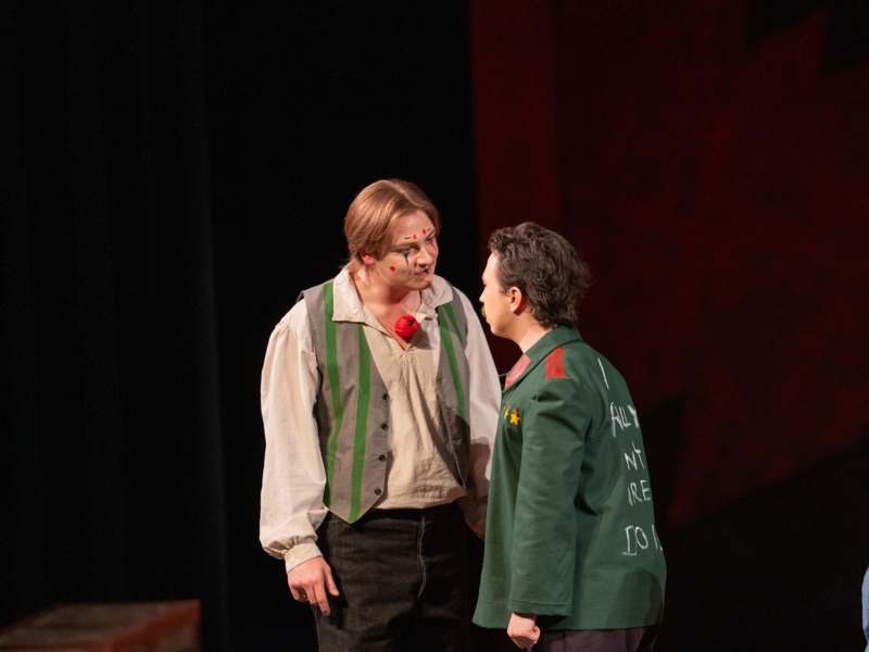 two men in garment on stage