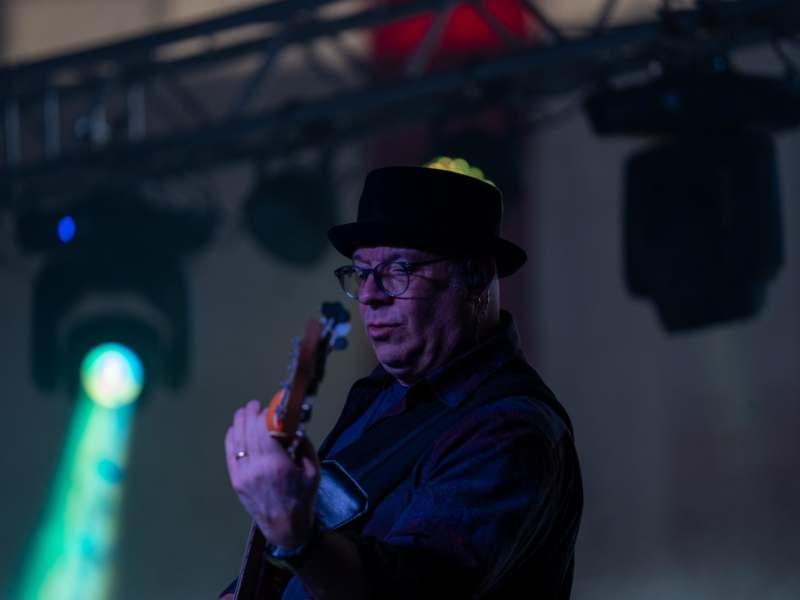 a man playing a guitar