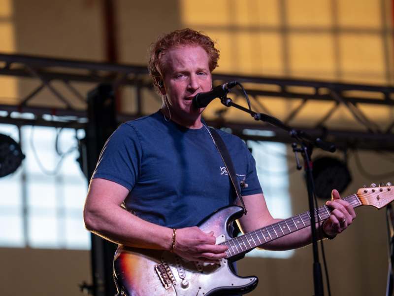 a man playing a guitar