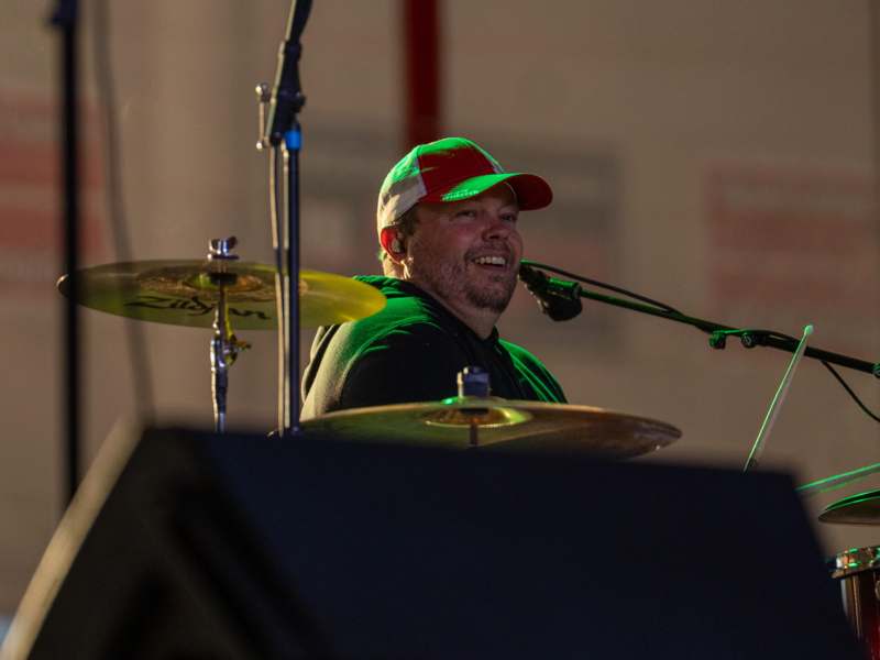 a man playing drums on stage