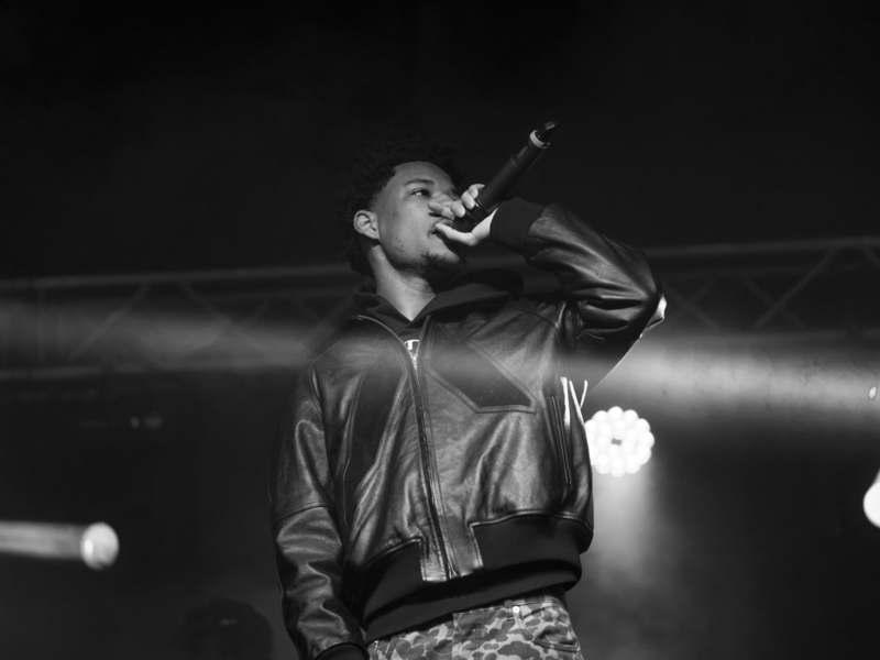 a man singing into a microphone