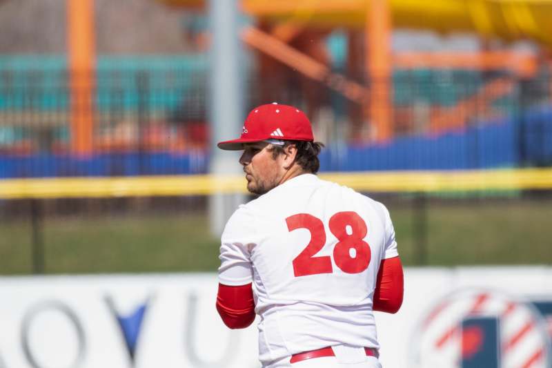 a baseball player in a red hat