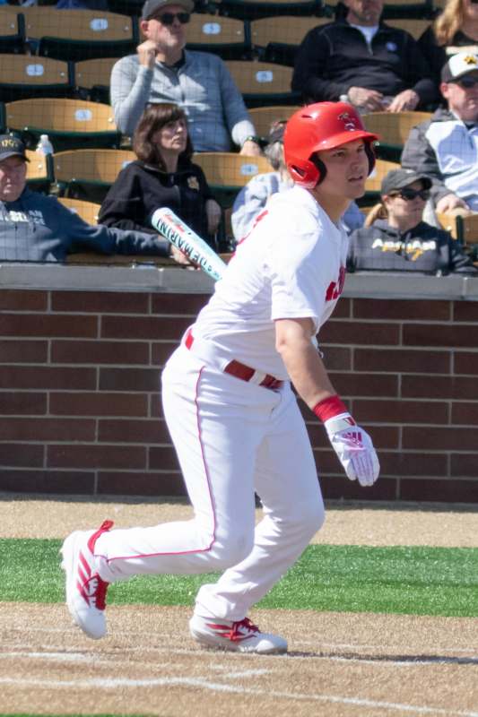 a baseball player in a red helmet