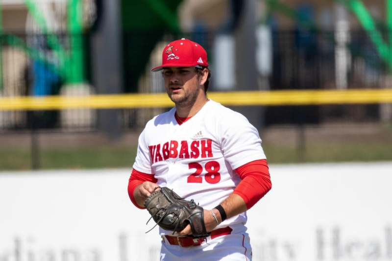 a baseball player in a red hat
