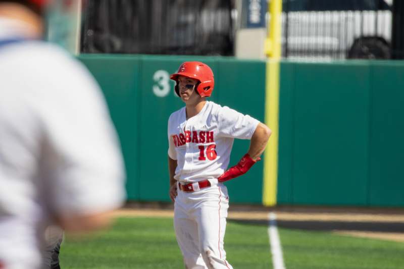 a baseball player standing on a field