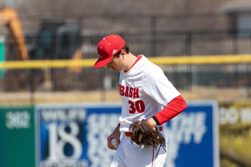 a baseball player in a red hat