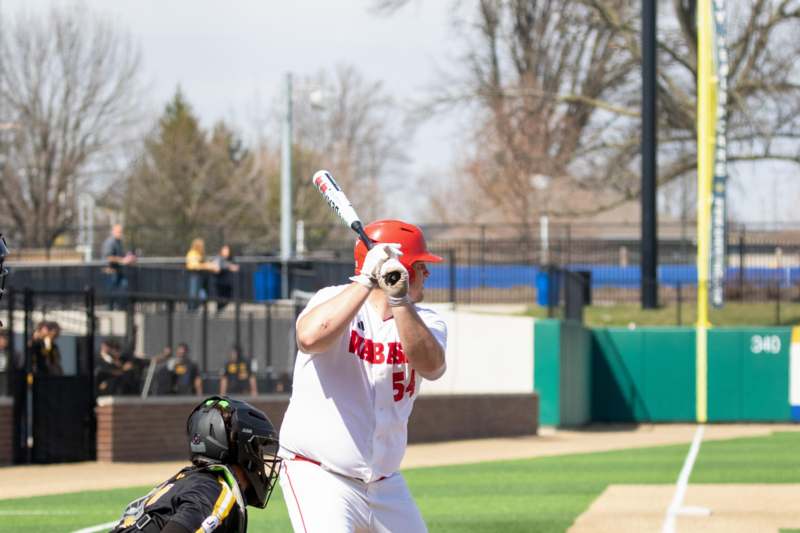 a baseball player holding a bat