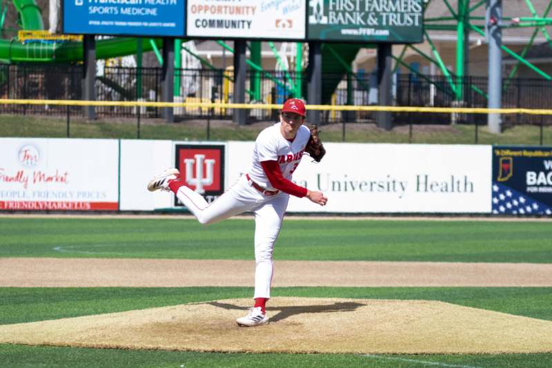 a baseball player throwing a ball