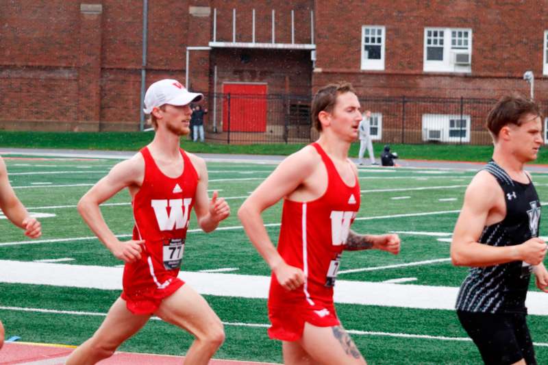 a group of men running on a track