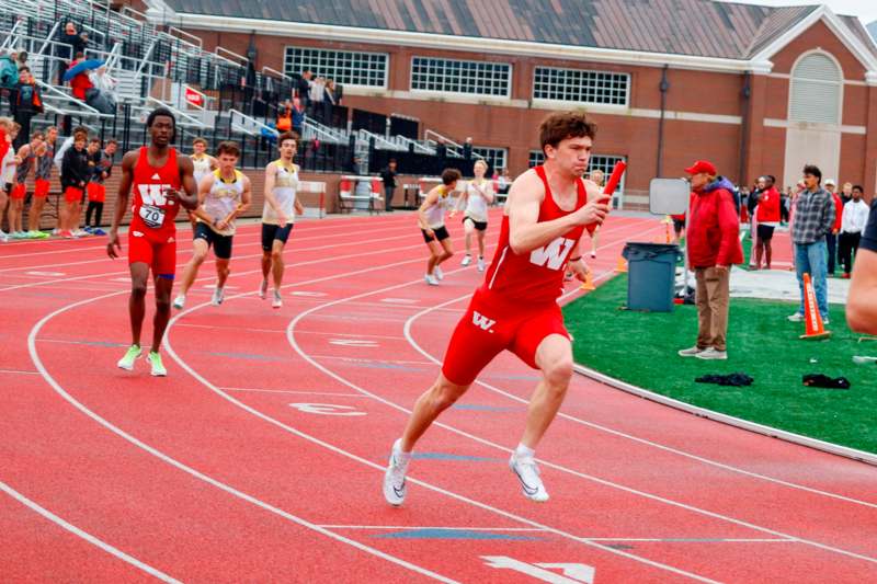 a group of people running on a track
