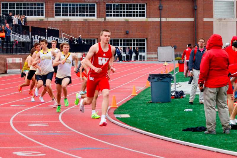 a group of people running on a track