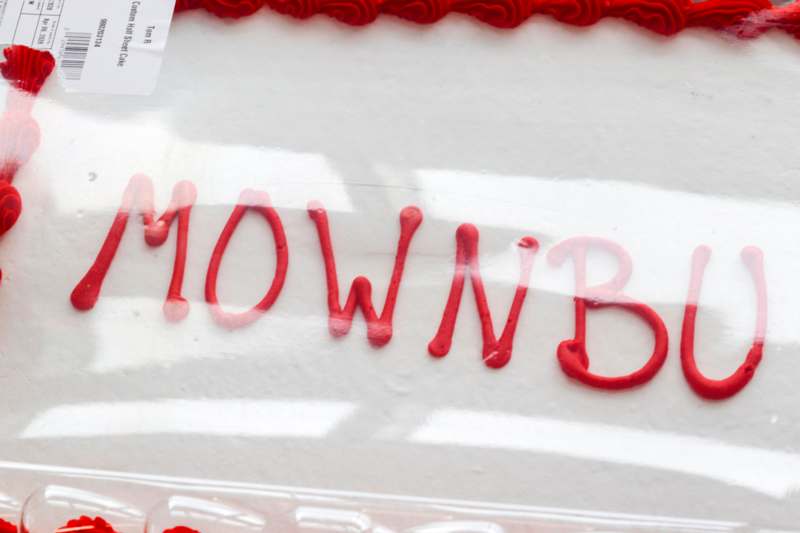 a cake with red frosting on it