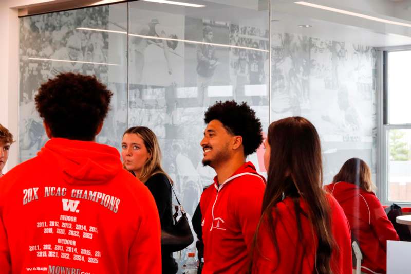 a group of people in red jackets