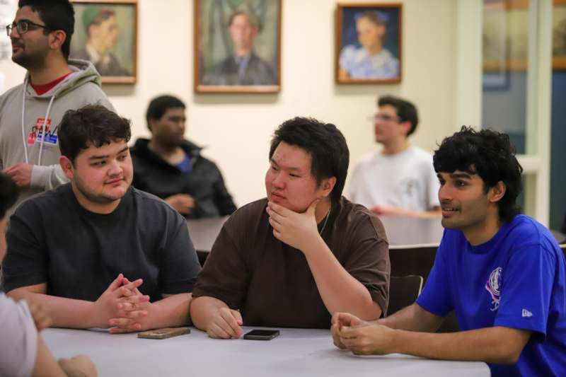 a group of people sitting at a table