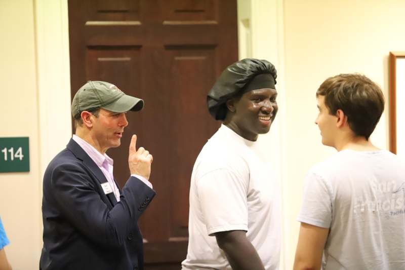 a man pointing at another man