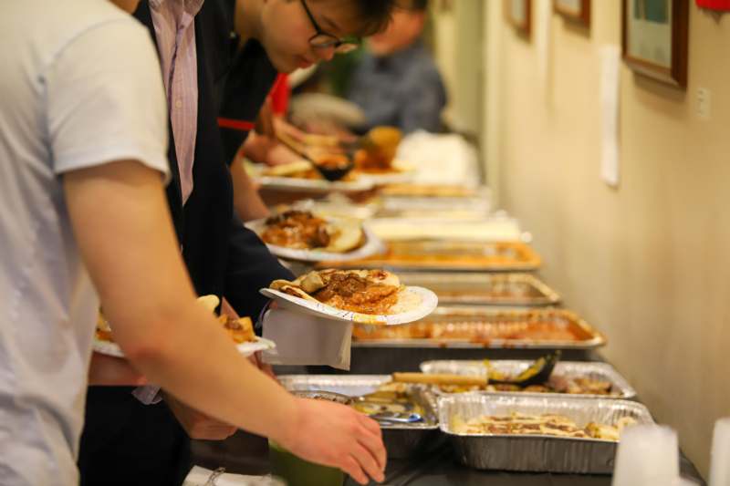 a group of people serving food