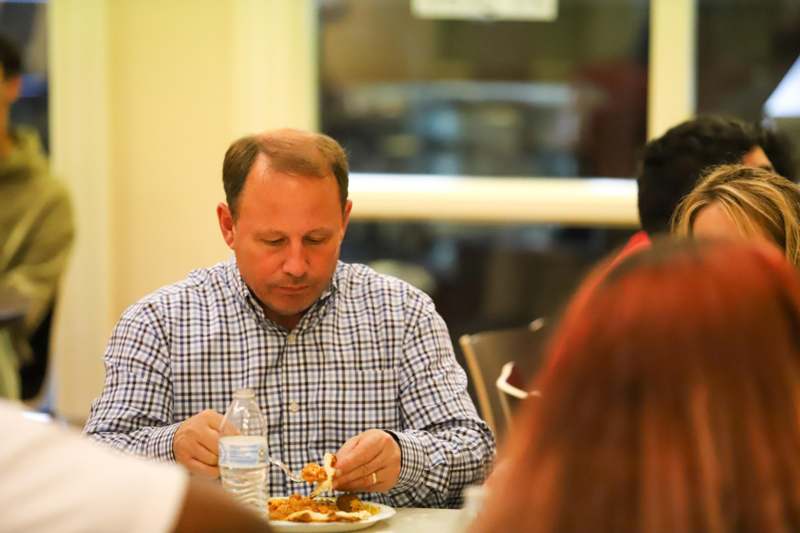 a man eating food at a table