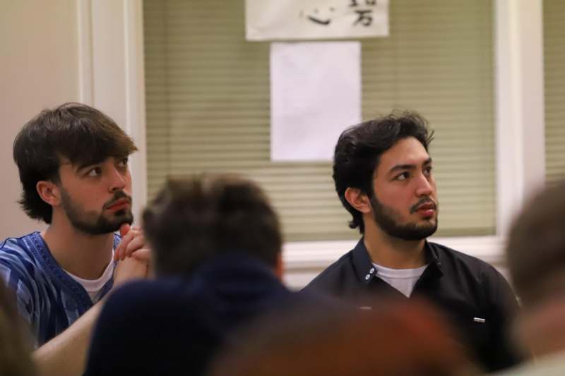 a group of men sitting in a room