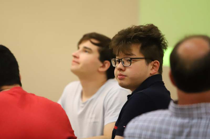 a group of people sitting in a room