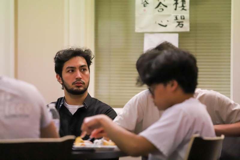 a group of people sitting at a table