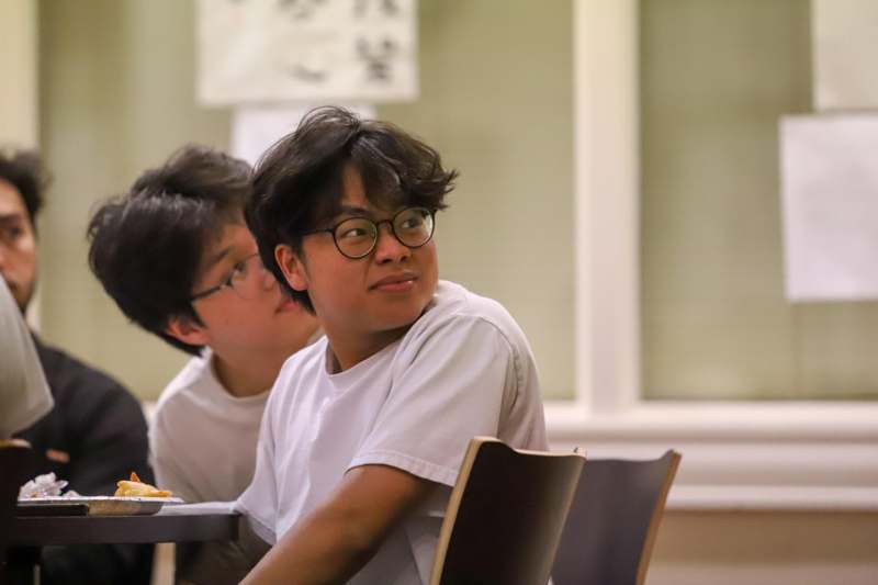 a group of people sitting at a table