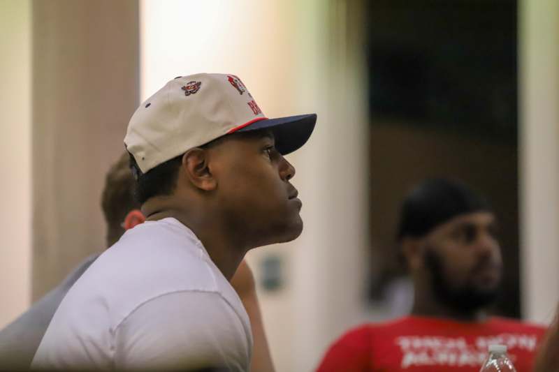 a man in a white hat