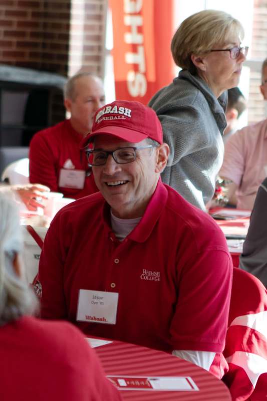 a man wearing a red cap and a red shirt