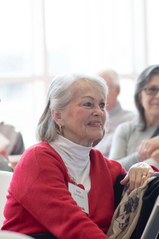 a woman in a red sweater