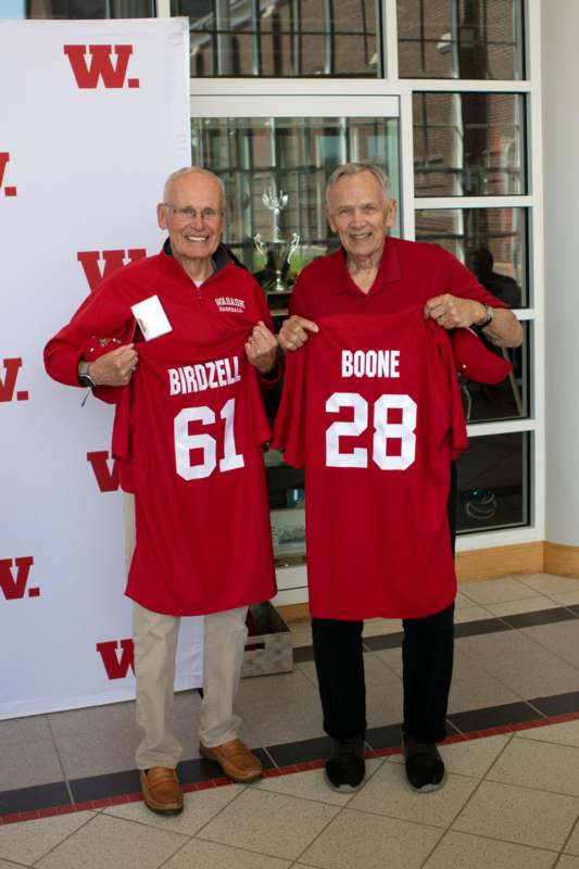 two men wearing red jerseys