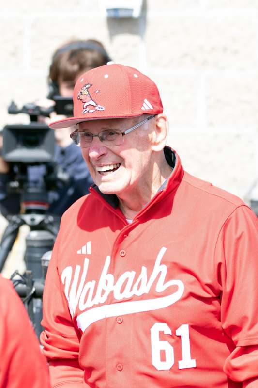 a man in a red baseball cap and red shirt