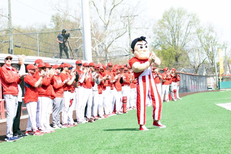 a person in a garment standing in a row of people